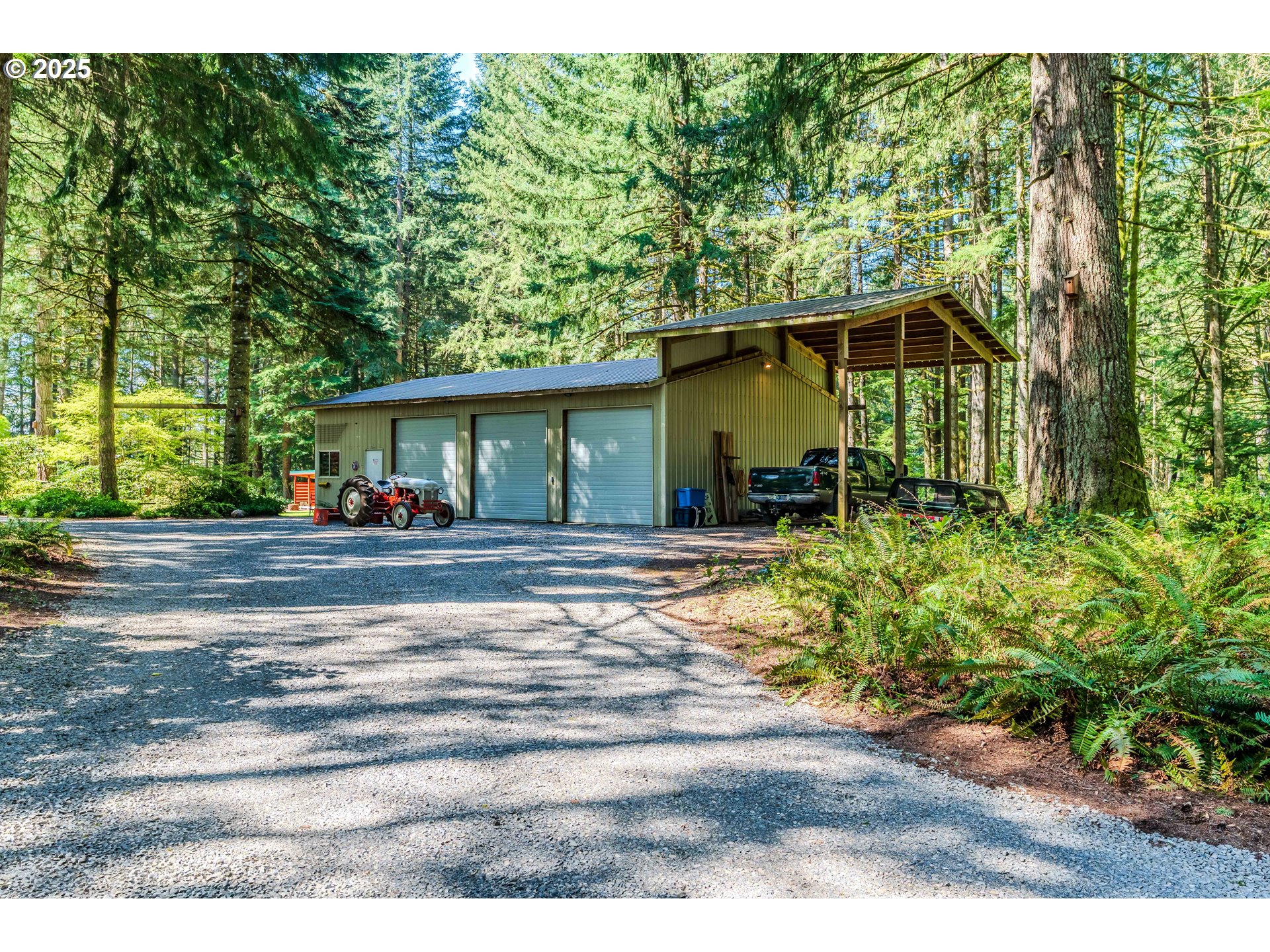 41920 Southeast Gordon Creek Road Corbett, OR 97019 - Photo 36 of 48 a front view of a house with garden