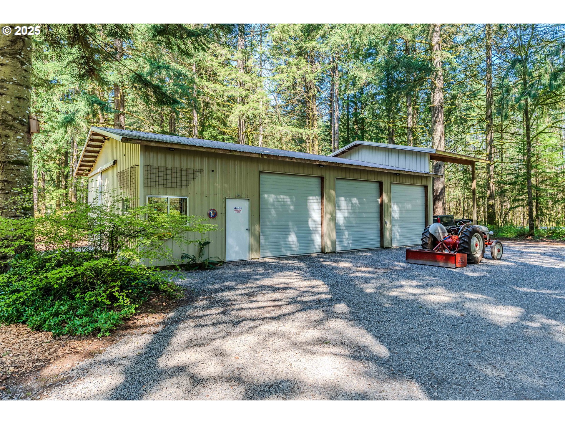 41920 Southeast Gordon Creek Road Corbett, OR 97019 - Photo 37 of 48 a view of a house with large trees and plants