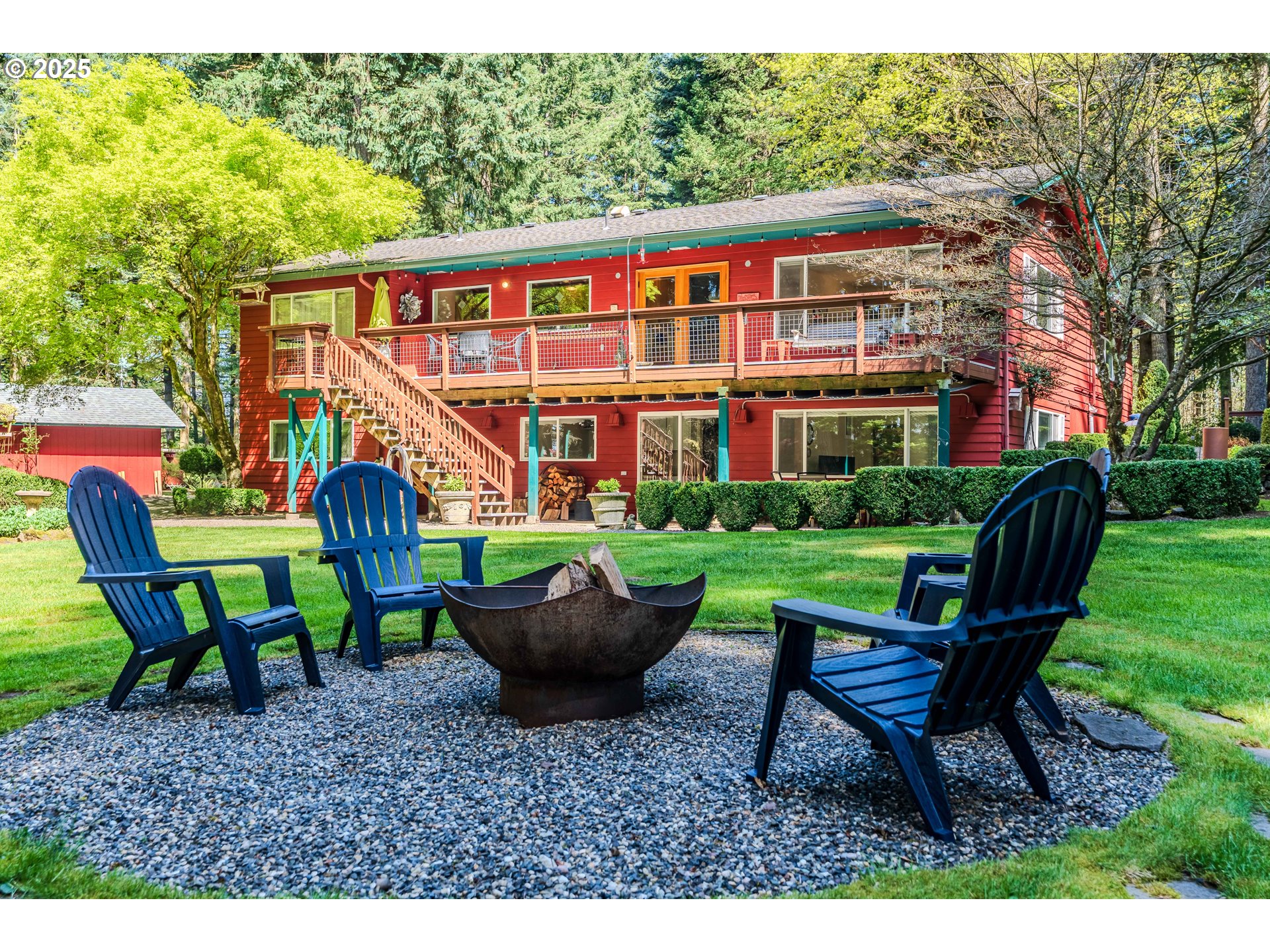 41920 Southeast Gordon Creek Road Corbett, OR 97019 - Photo 4 of 48 a view of a house with backyard sitting area and garden