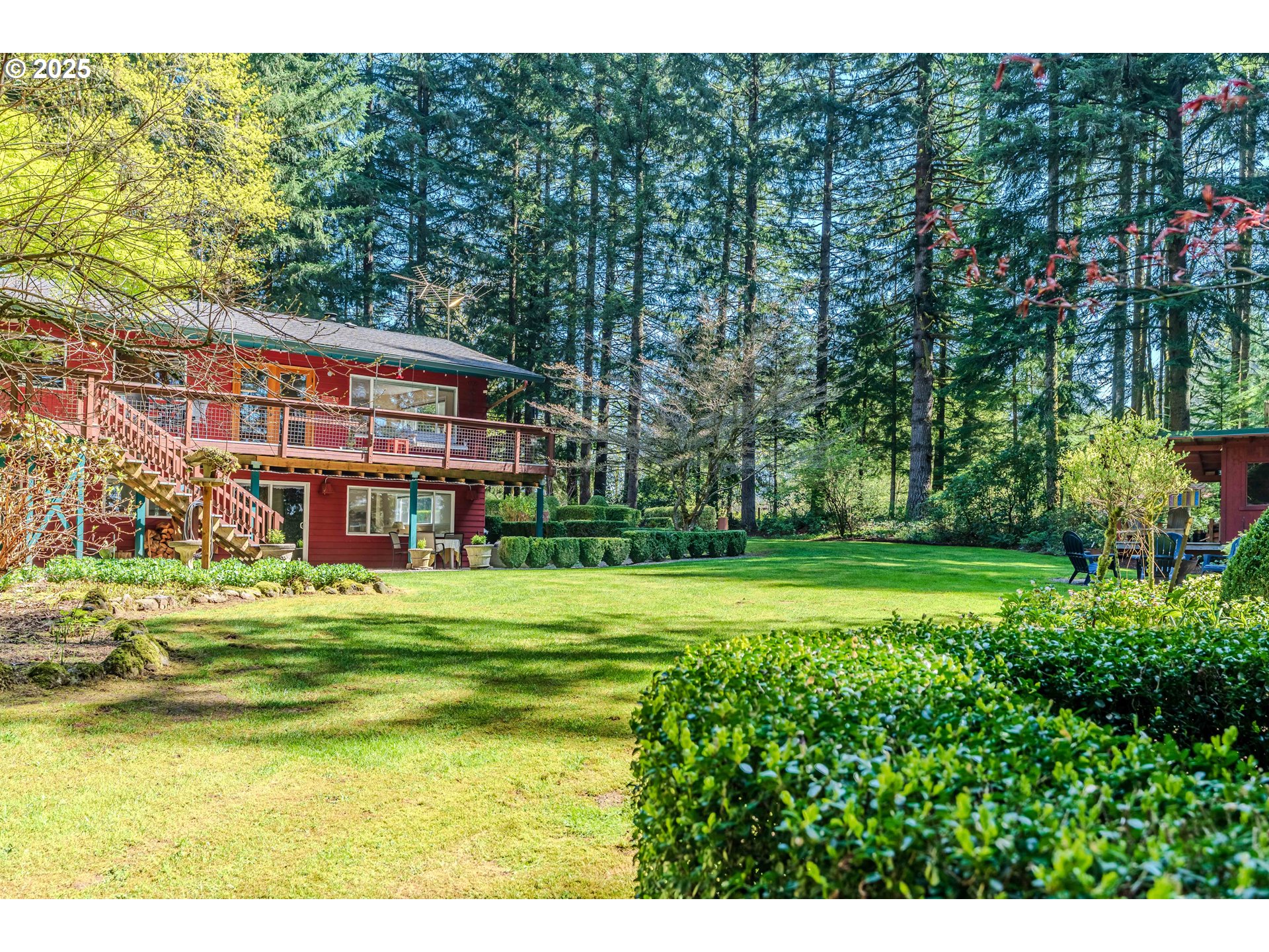 41920 Southeast Gordon Creek Road Corbett, OR 97019 - Photo 45 of 48 a view of a big building with big yard and large trees