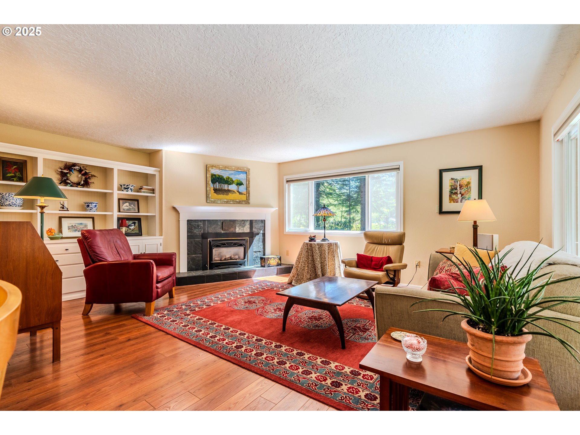 41920 Southeast Gordon Creek Road Corbett, OR 97019 - Photo 6 of 48 a living room with furniture fireplace and a large window