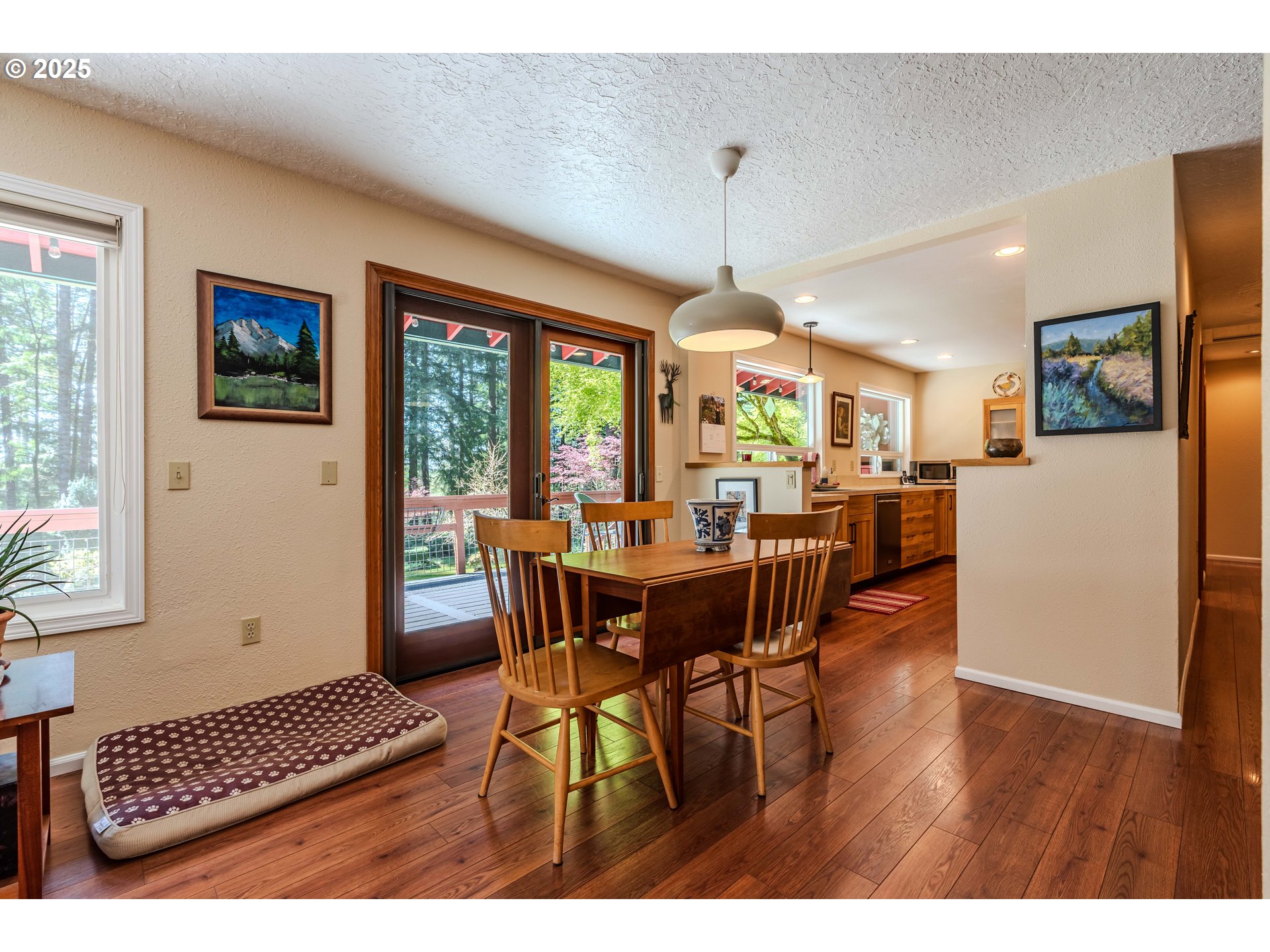 41920 Southeast Gordon Creek Road Corbett, OR 97019 - Photo 7 of 48 a view of a dining room with furniture window and wooden floor