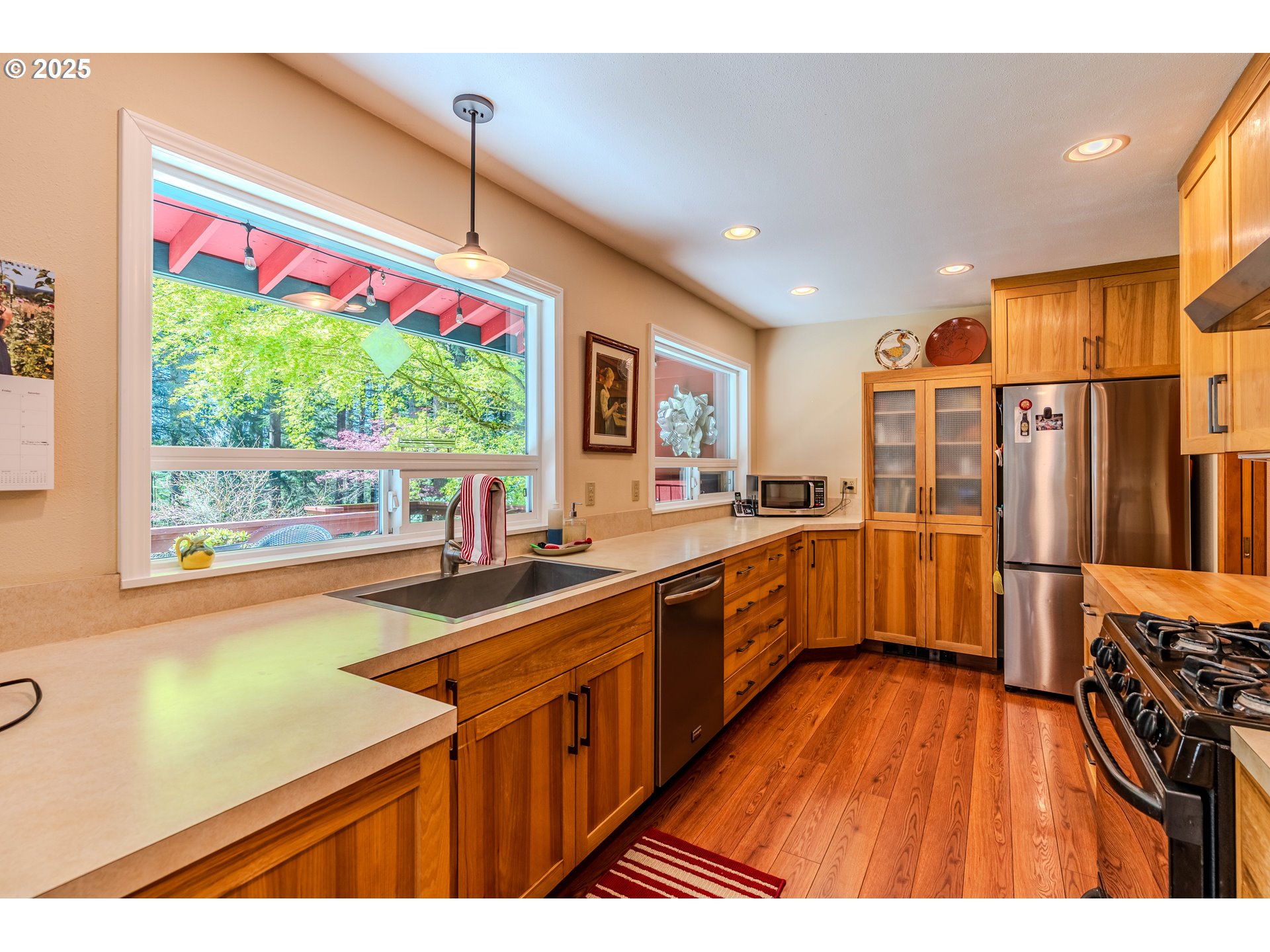 41920 Southeast Gordon Creek Road Corbett, OR 97019 - Photo 8 of 48 a kitchen that has a lot of counter space and a large window