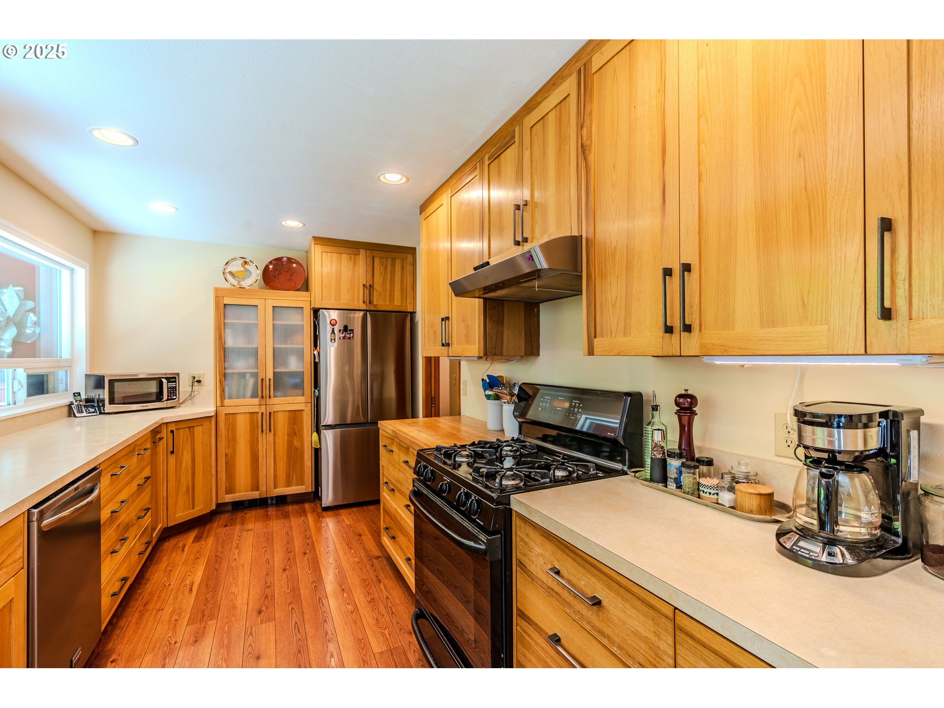 41920 Southeast Gordon Creek Road Corbett, OR 97019 - Photo 10 of 48 a kitchen with granite countertop a stove a sink dishwasher and a refrigerator with wooden floor