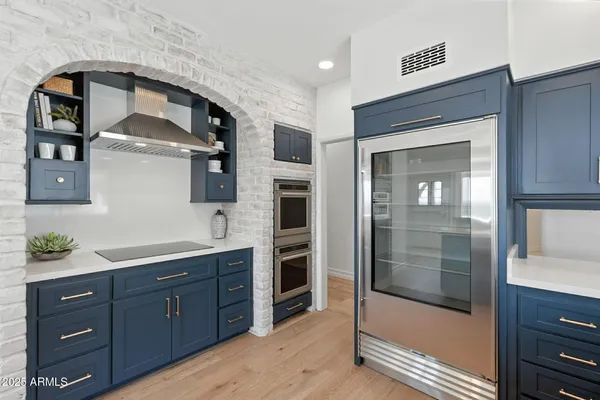 a kitchen with a sink and a large window