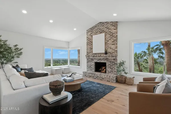 a living room with furniture and a fireplace
