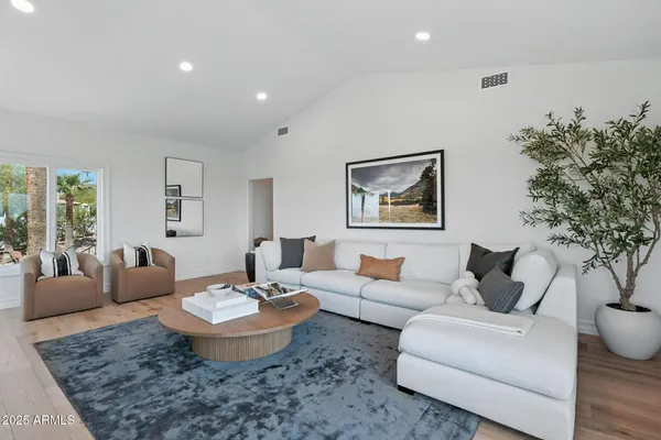 a living room with furniture and a large window