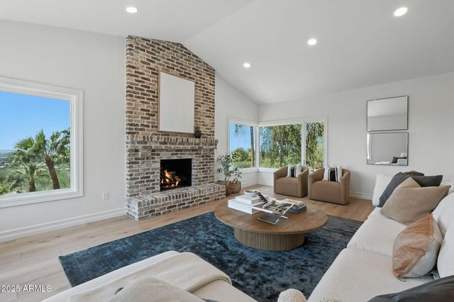 a bedroom with a large bed and a couch