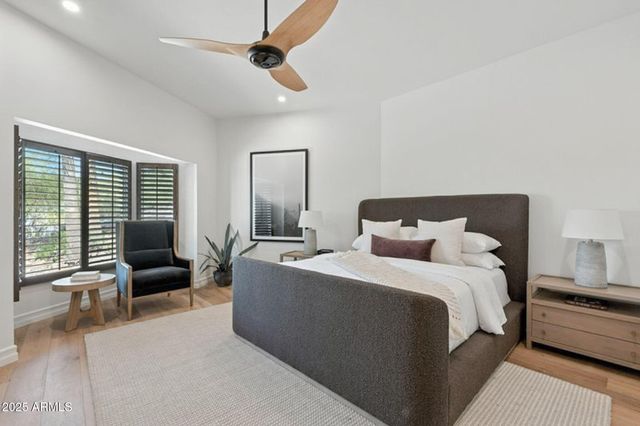 a bedroom with a bed and a fireplace