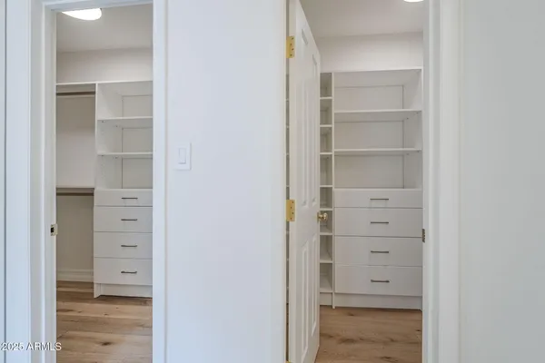 a bathroom with a shower a sink and a mirror