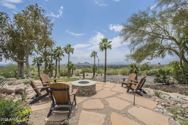 a view of outdoor space with seating area and trees