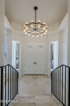 a view of a hallway with chandelier