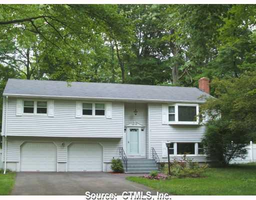 75 Discovery Road Vernon, CT 06066 - Photo 1 of 1 a front view of a house with a garden