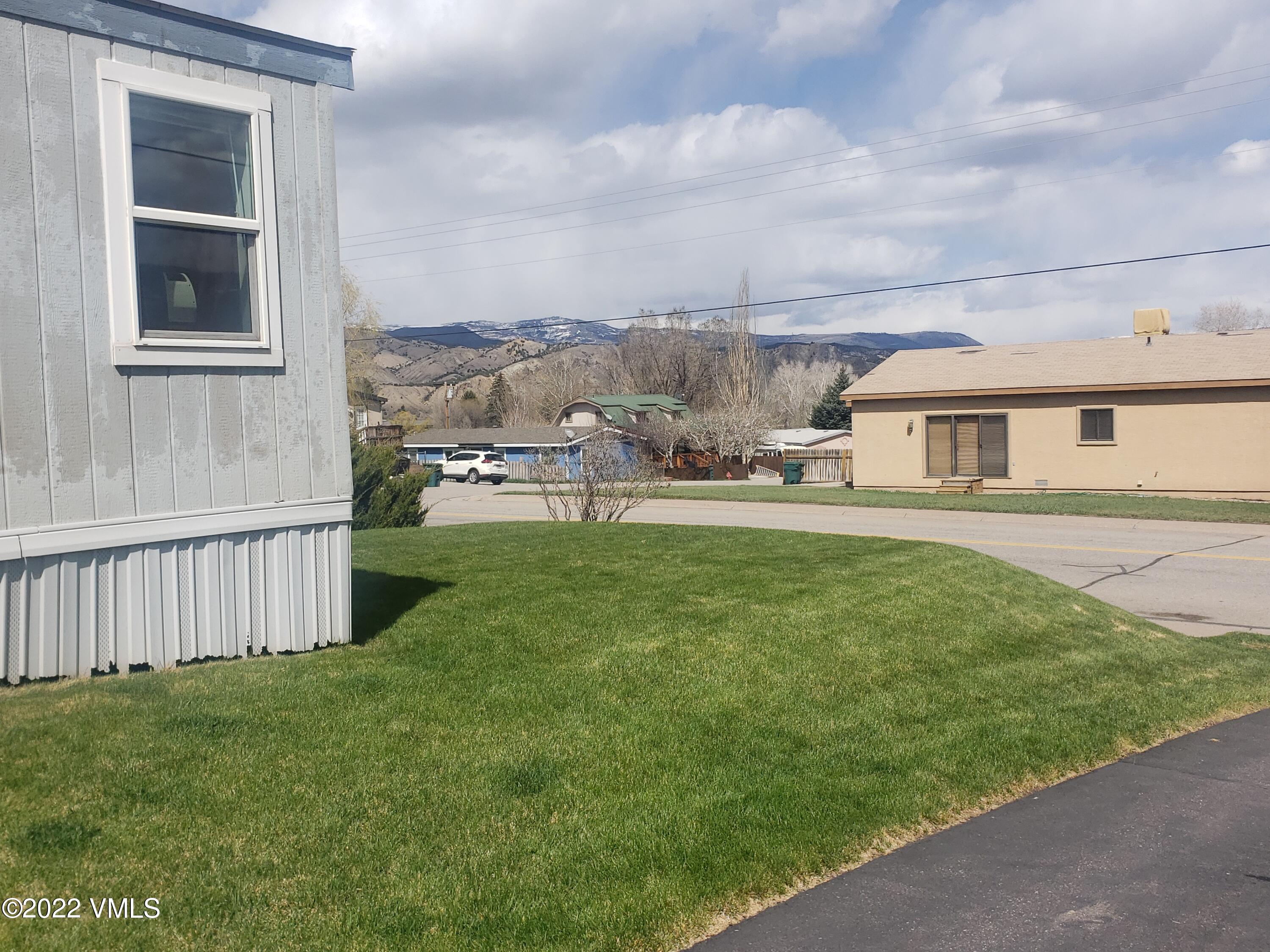 742 2nd Street Gypsum, CO 81637 - Photo 17 of 17 a view of a house with a yard and sitting area