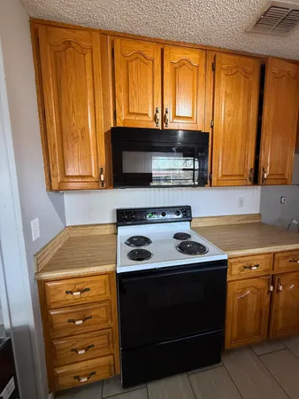 a kitchen with a stove and a sink