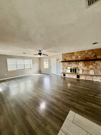 a view of a living room with hardwood floor