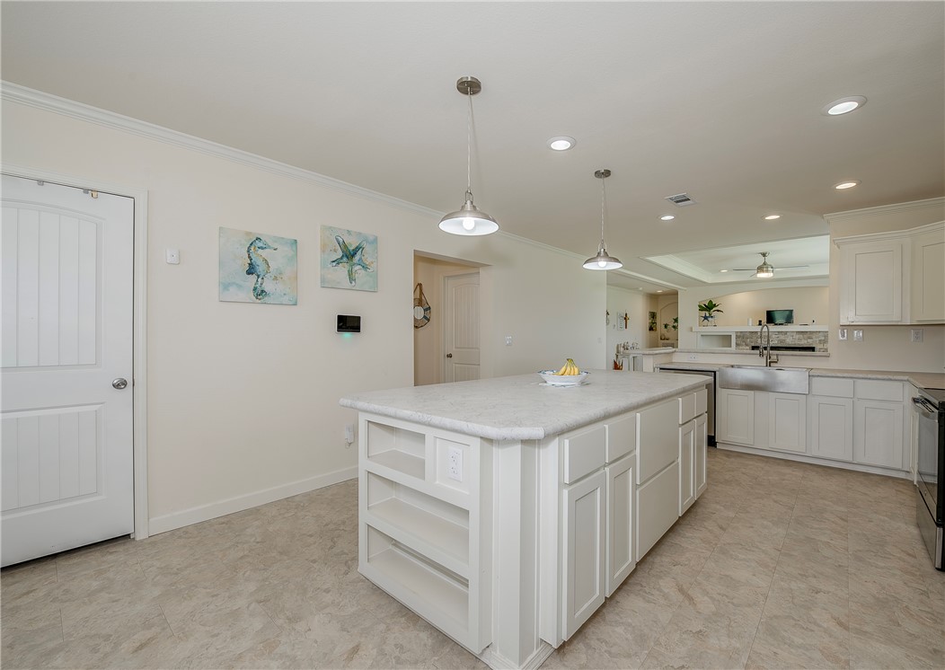 10976 Whiterock Road Bremond, TX 76629 - Photo 8 of 42 a kitchen with a sink a counter top space and appliances