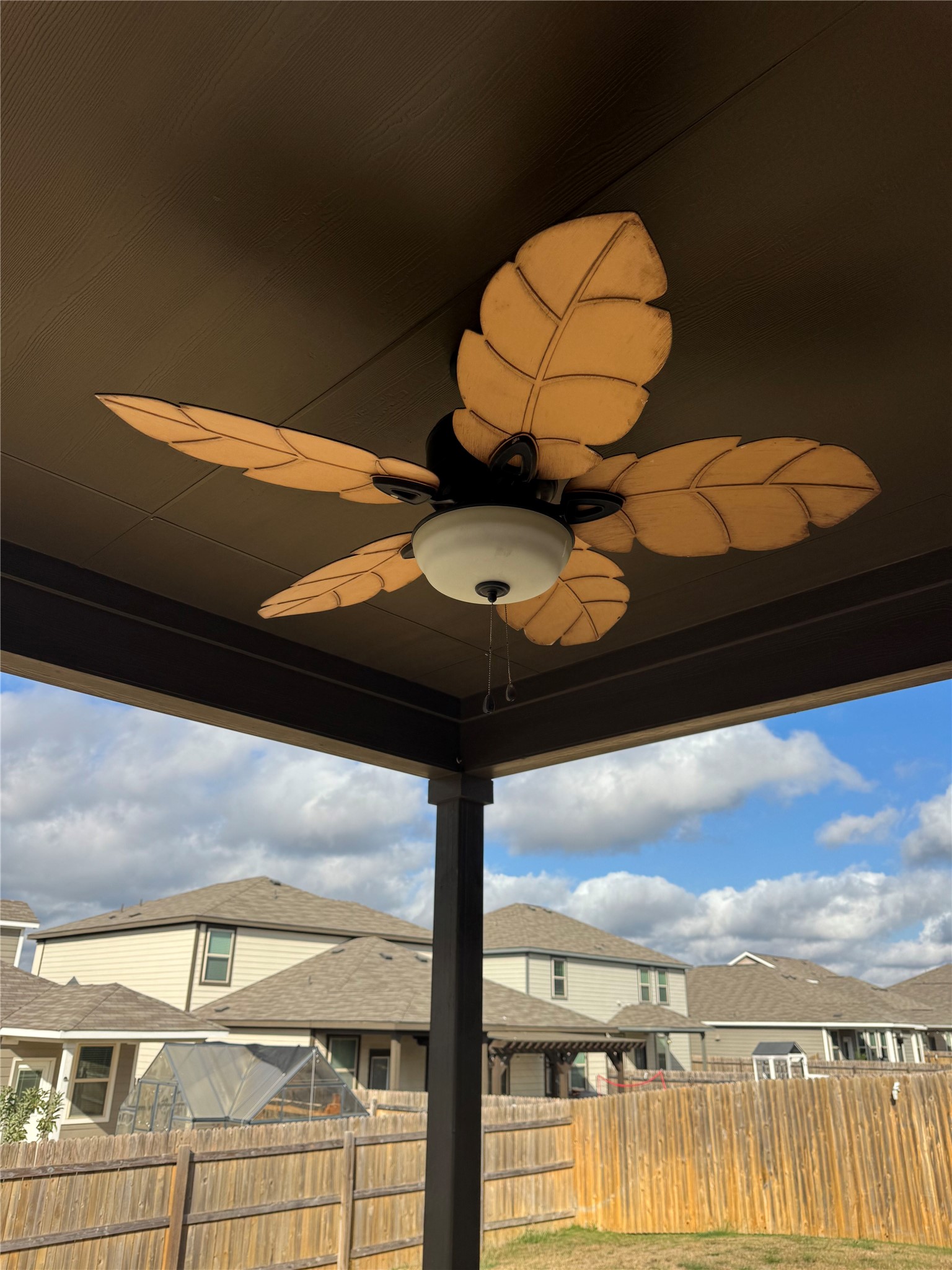 333 Capstone Road Liberty Hill, TX 78642 - Photo 20 of 40 Exterior view of ceiling fan, a fenced backyard, and a residential view