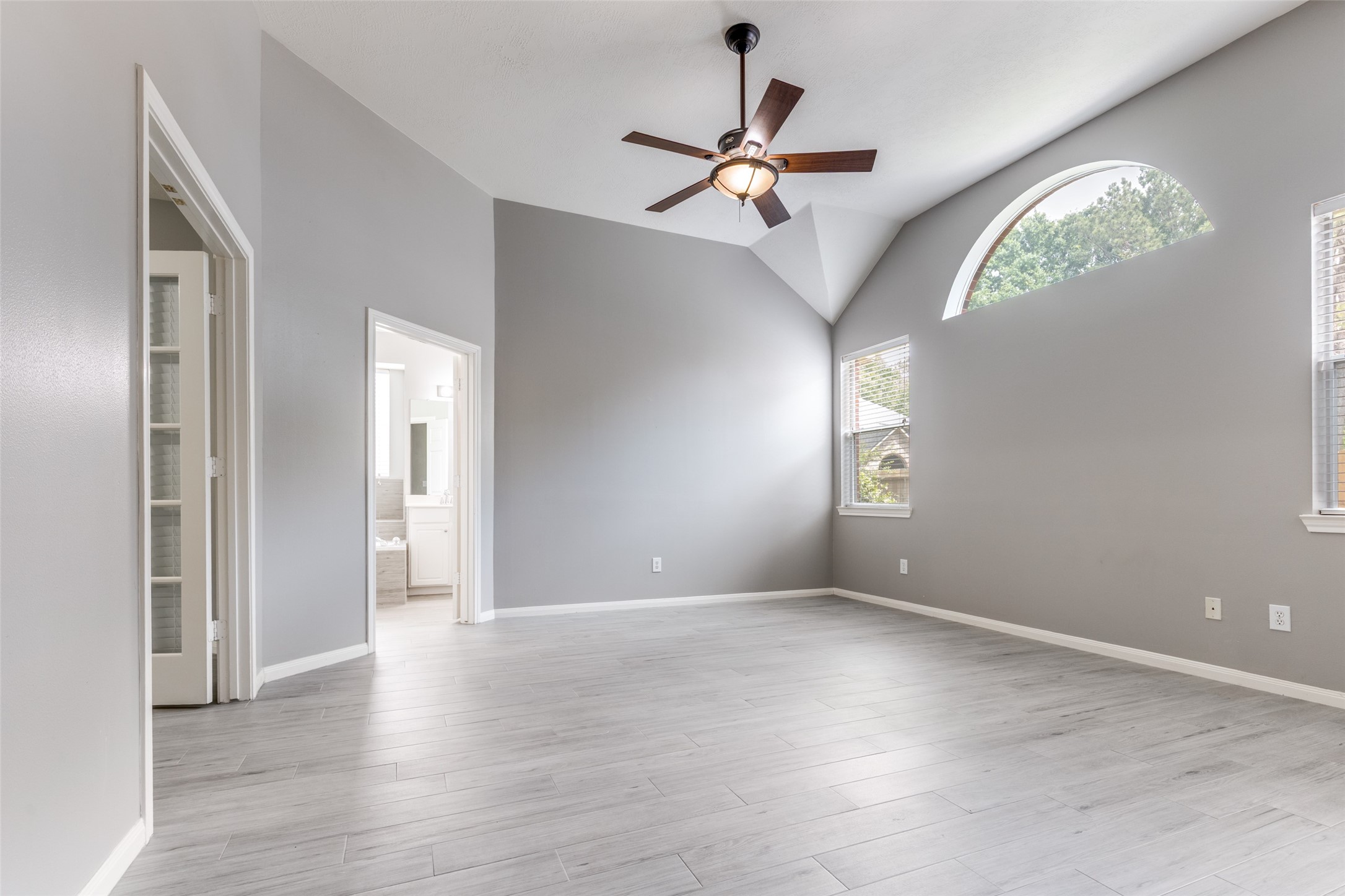20710 Water Point Trail Humble, TX 77346 - Photo 11 of 29 The large primary bedroom features a versatile flex room with French doors—perfect for a nursery or home office.