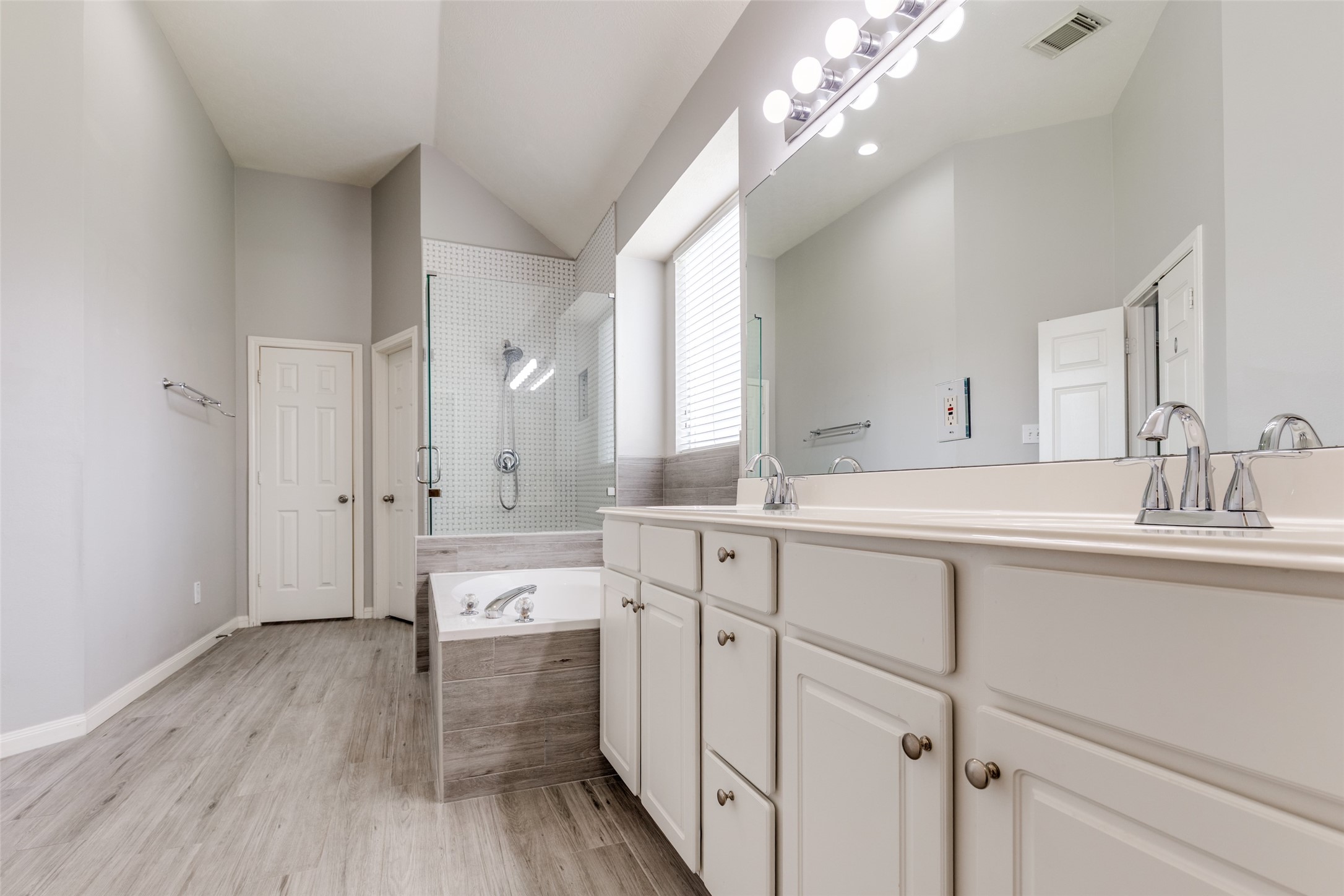 20710 Water Point Trail Humble, TX 77346 - Photo 15 of 29 Enjoy the convenience of double sinks, two spacious closets, and a private toilet room, all designed for ultimate comfort.