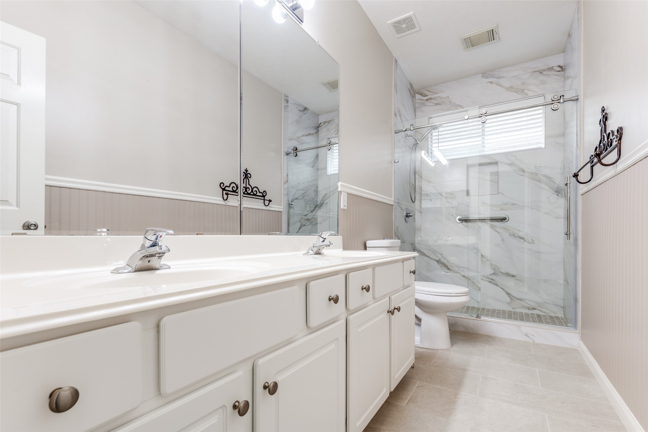 20710 Water Point Trail Humble, TX 77346 - Photo 18 of 29 The stylish hall/guest bathroom features an expansive walk-in shower that promises relaxation and elegance.