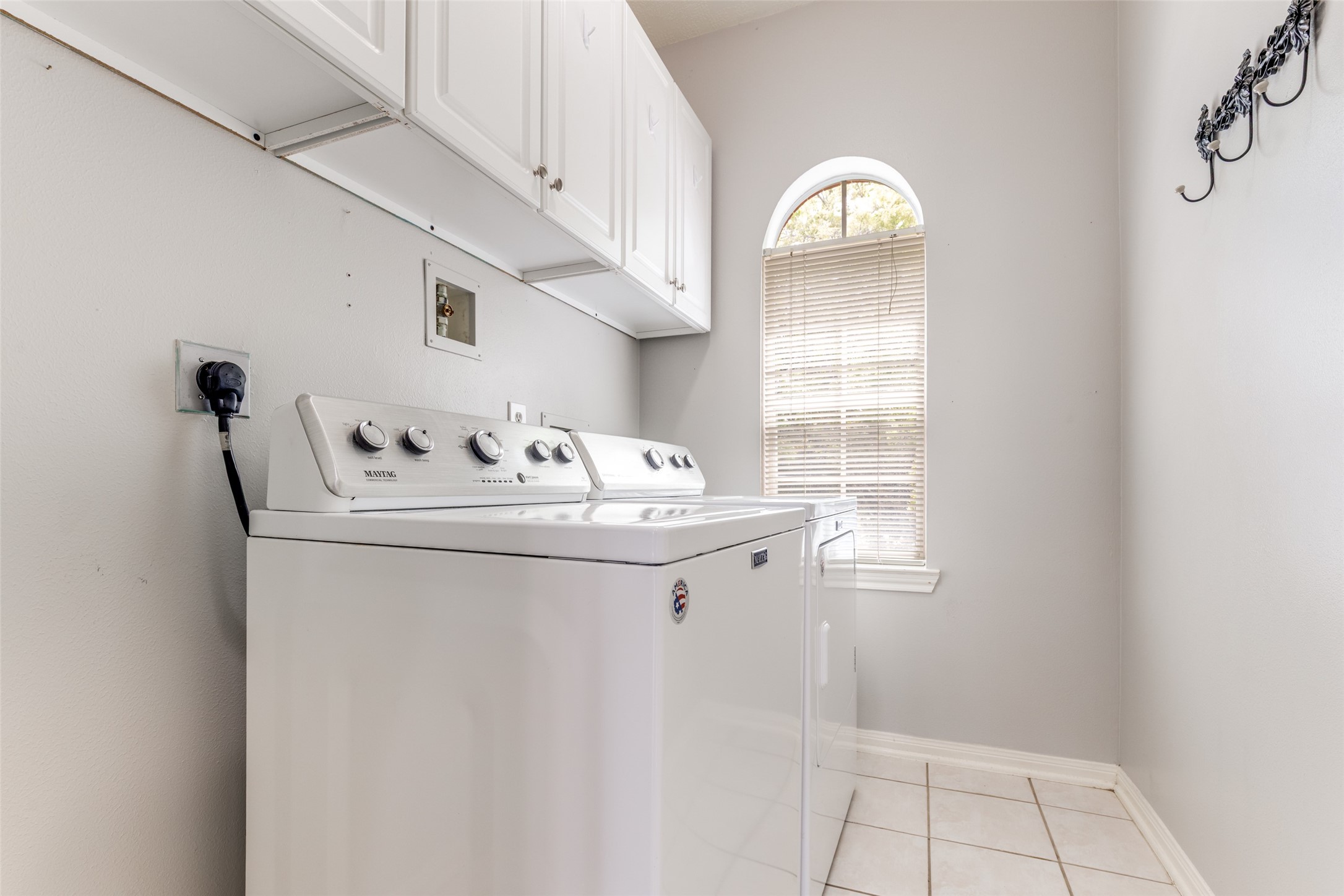 20710 Water Point Trail Humble, TX 77346 - Photo 20 of 29 The spacious laundry room is brimming with storage options and ample space for a stand-up freezer or extra fridge.