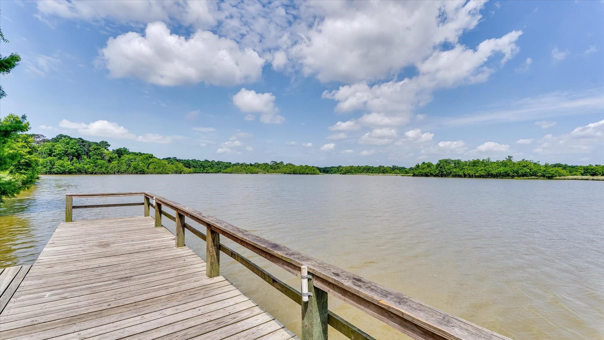 20710 Water Point Trail Humble, TX 77346 - Photo 29 of 29 Experience serene waterfront views from this neighborhood pier, where tranquility meets natural beauty.