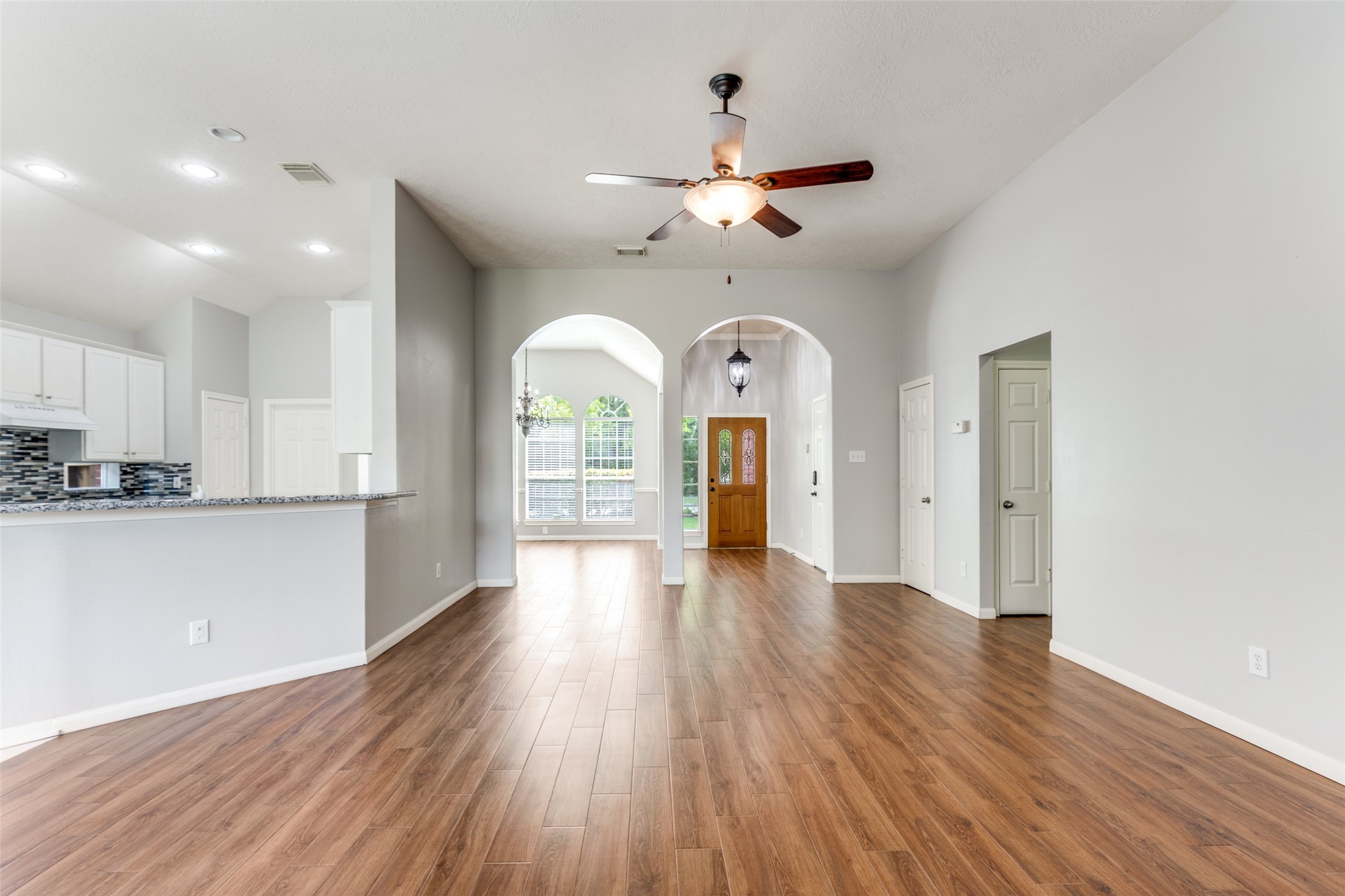 20710 Water Point Trail Humble, TX 77346 - Photo 6 of 29 The seamless flow from the entryway and dining area, all viewed from the living room.