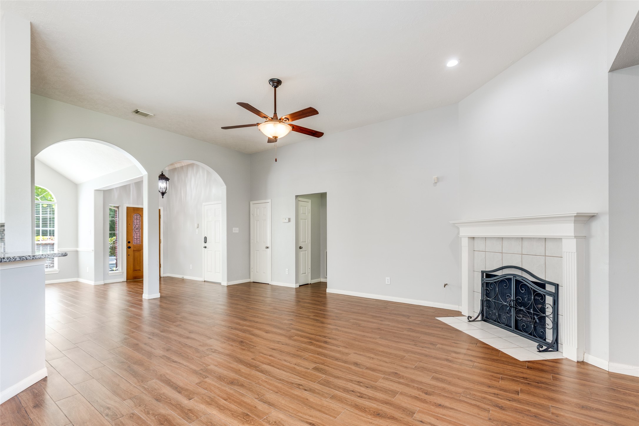 20710 Water Point Trail Humble, TX 77346 - Photo 8 of 29 From the back door, step into the breakfast area and the bright, inviting living room with a gas-log fireplace.