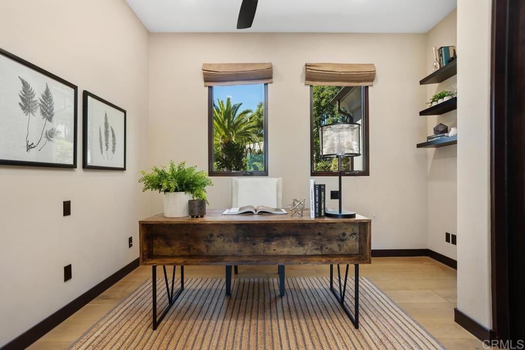 1159 Larksong Lane Encinitas, CA 92024 - Photo 24 of 68 a view of a workspace room with furniture window and wooden floor
