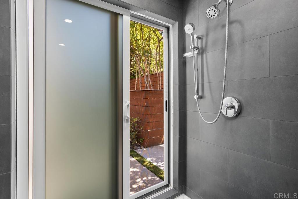 1159 Larksong Lane Encinitas, CA 92024 - Photo 35 of 68 a bathroom with a glass shower door