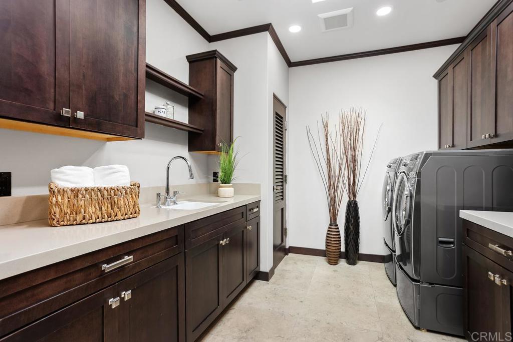 1159 Larksong Lane Encinitas, CA 92024 - Photo 36 of 68 a kitchen with stainless steel appliances granite countertop a refrigerator and a sink