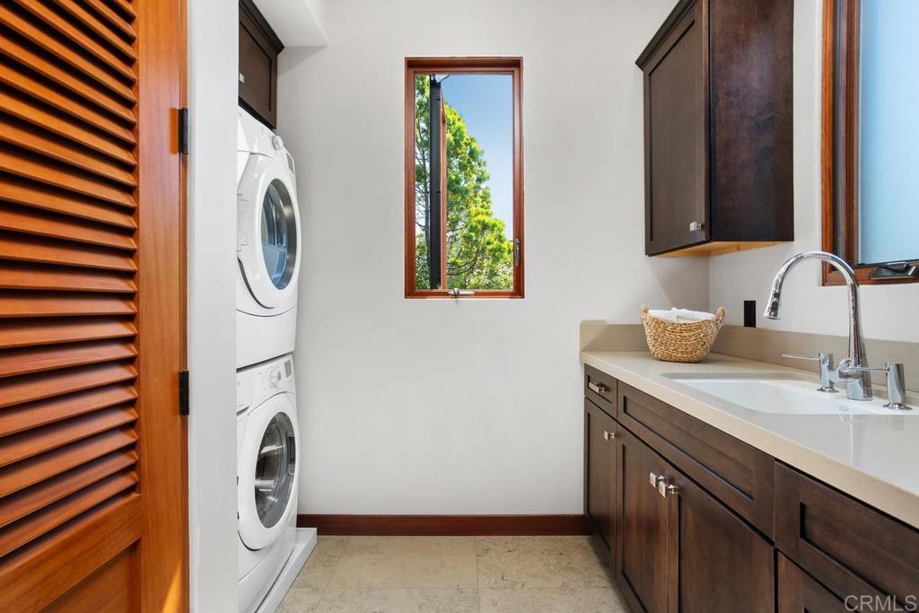 1159 Larksong Lane Encinitas, CA 92024 - Photo 38 of 68 a utility room with dryer and washer