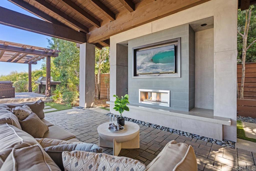 1159 Larksong Lane Encinitas, CA 92024 - Photo 50 of 68 a balcony with furniture and a potted plant