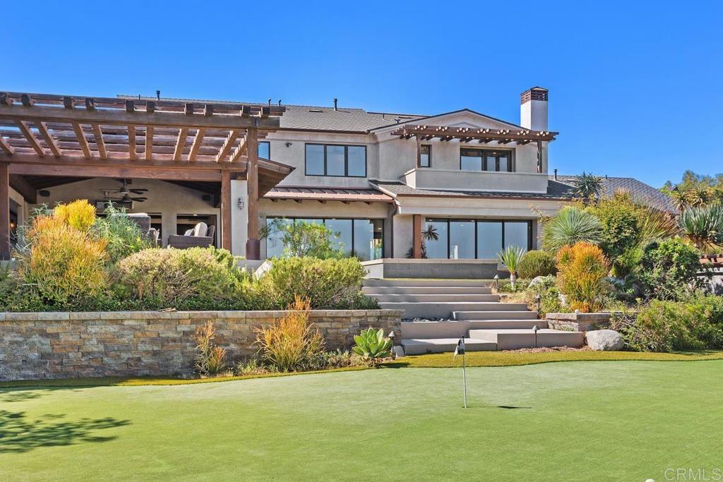 1159 Larksong Lane Encinitas, CA 92024 - Photo 54 of 68 a front view of a house with a garden and plants