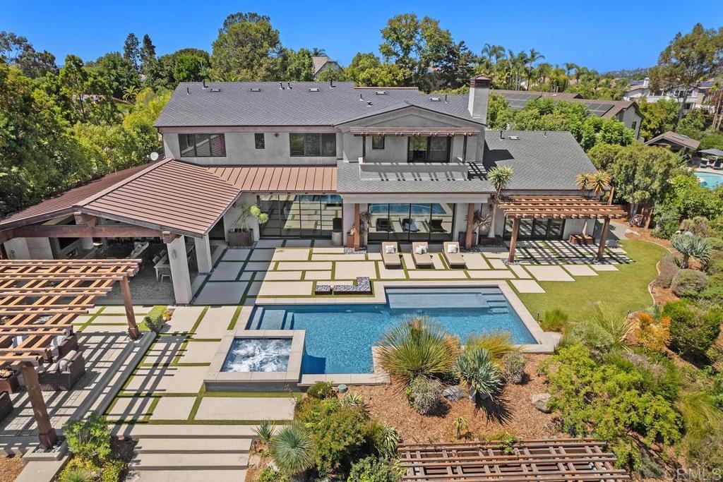 1159 Larksong Lane Encinitas, CA 92024 - Photo 59 of 68 a view of a house with pool and chairs