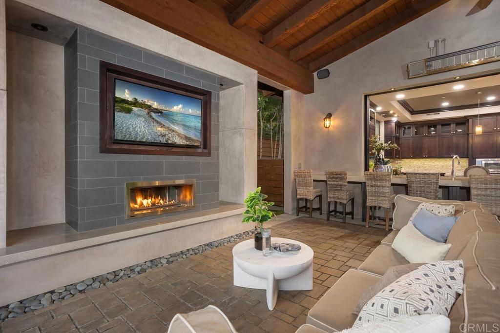 1159 Larksong Lane Encinitas, CA 92024 - Photo 62 of 68 a living room with furniture and a wooden floor