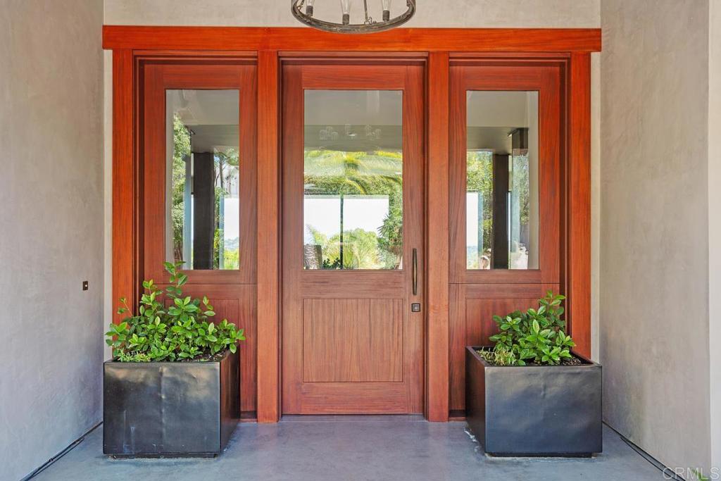 1159 Larksong Lane Encinitas, CA 92024 - Photo 8 of 68 front view of a house with a potted plant