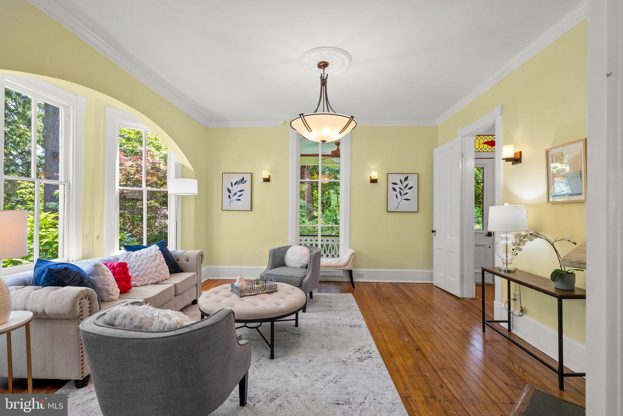 1102 Edgevale Road Silver Spring, MD 20910 - Photo 10 of 47 Living room with hardwood floors and chandelier