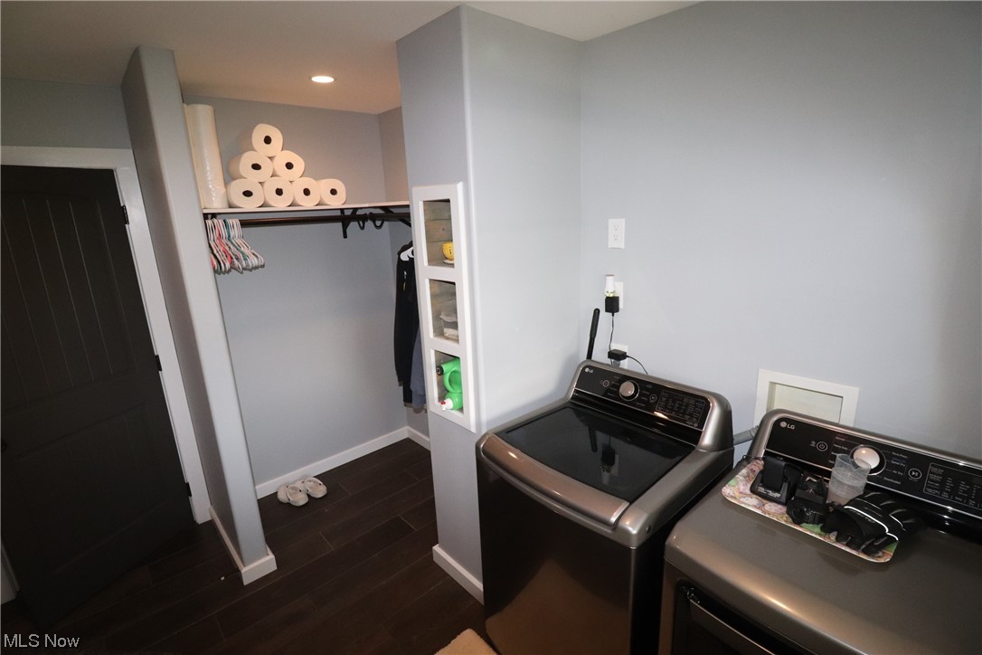 10582 Irvin Road Creston, OH 44217 - Photo 20 of 47 Laundry area with dark hardwood / wood-style flooring, separate washer and dryer, and washer hookup