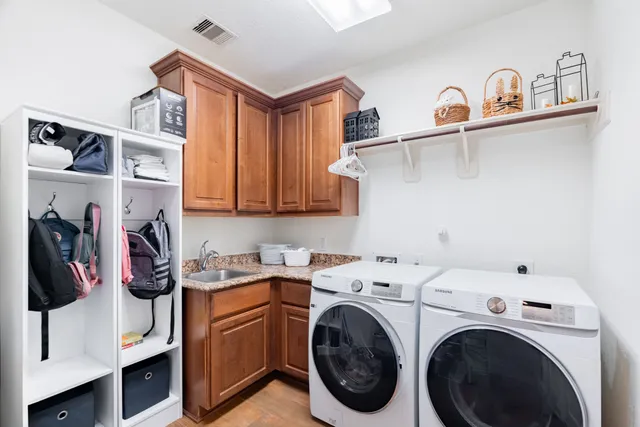 a view of storage and utility room with washer and dryer