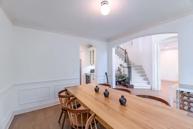 a view of a workspace with furniture and window