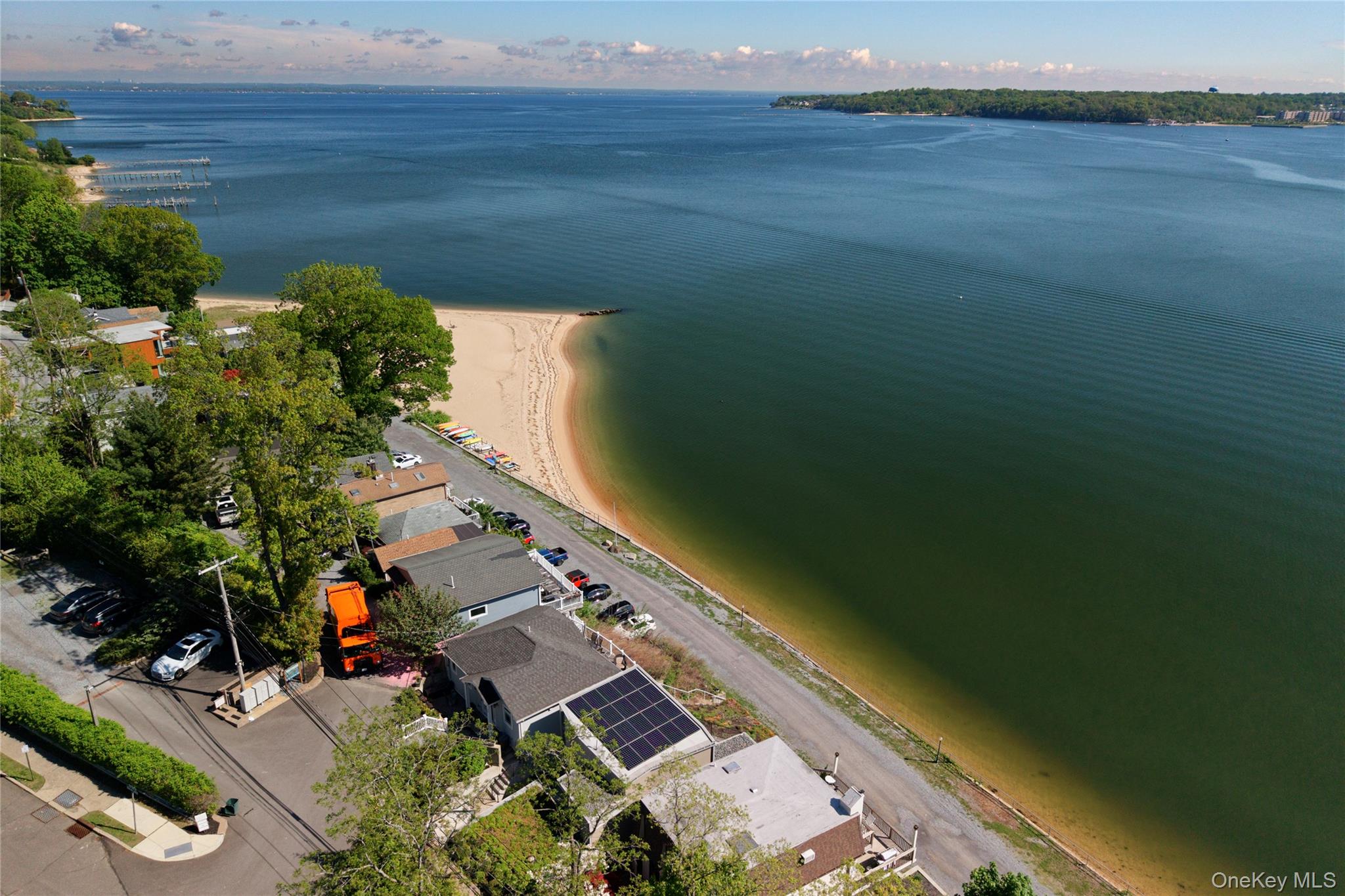 75-34 West Shore Road, Unit 34 Port Washington, NY 11050 - Photo 21 of 22 Aerial view. Solar panels. Private beach.
