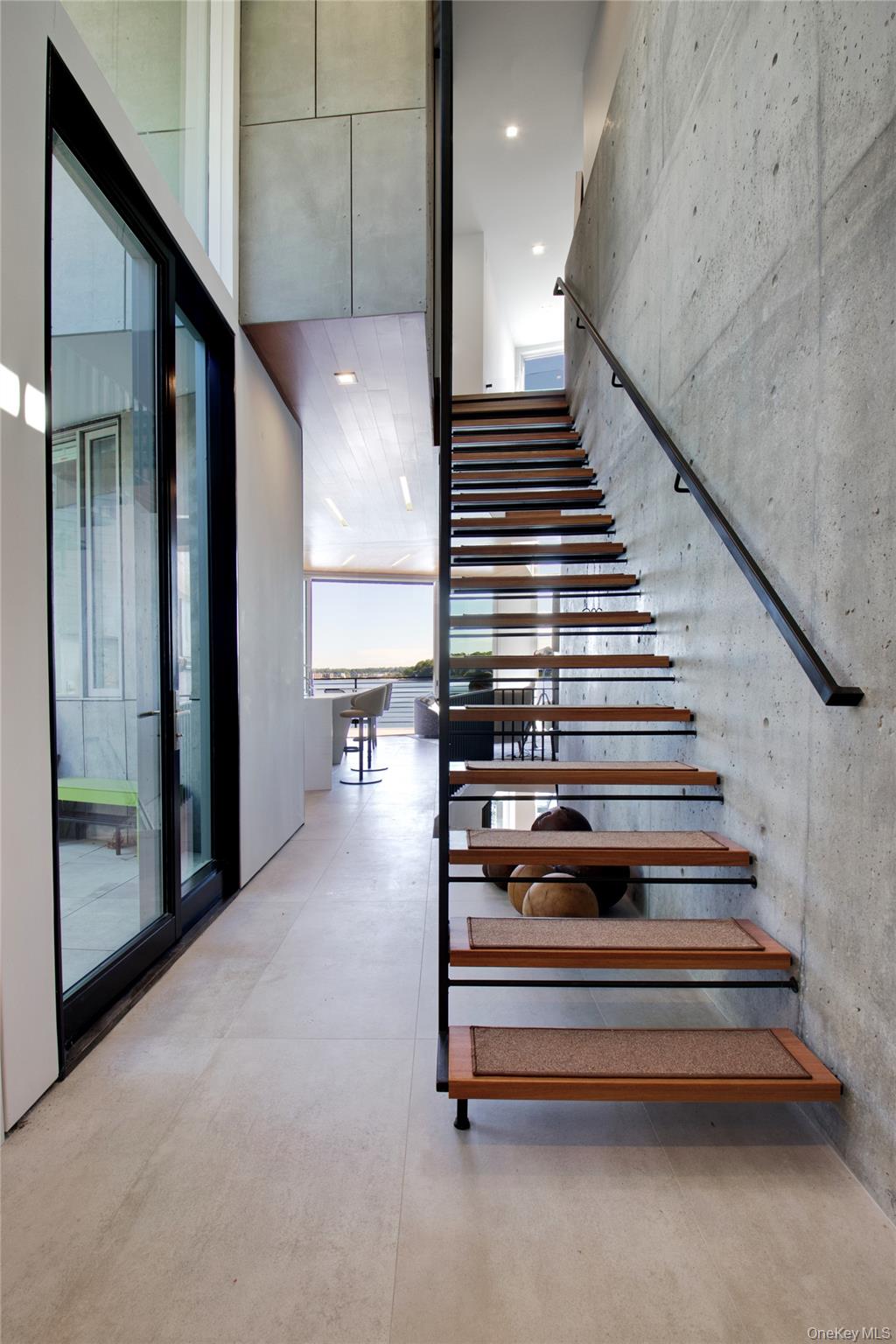 75-34 West Shore Road, Unit 34 Port Washington, NY 11050 - Photo 10 of 22 Floating staircase