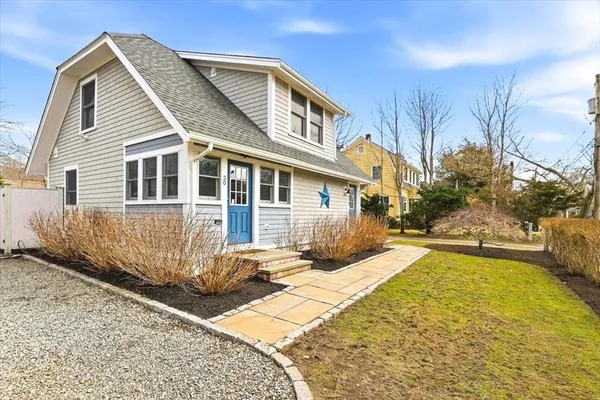 a front view of a house with yard
