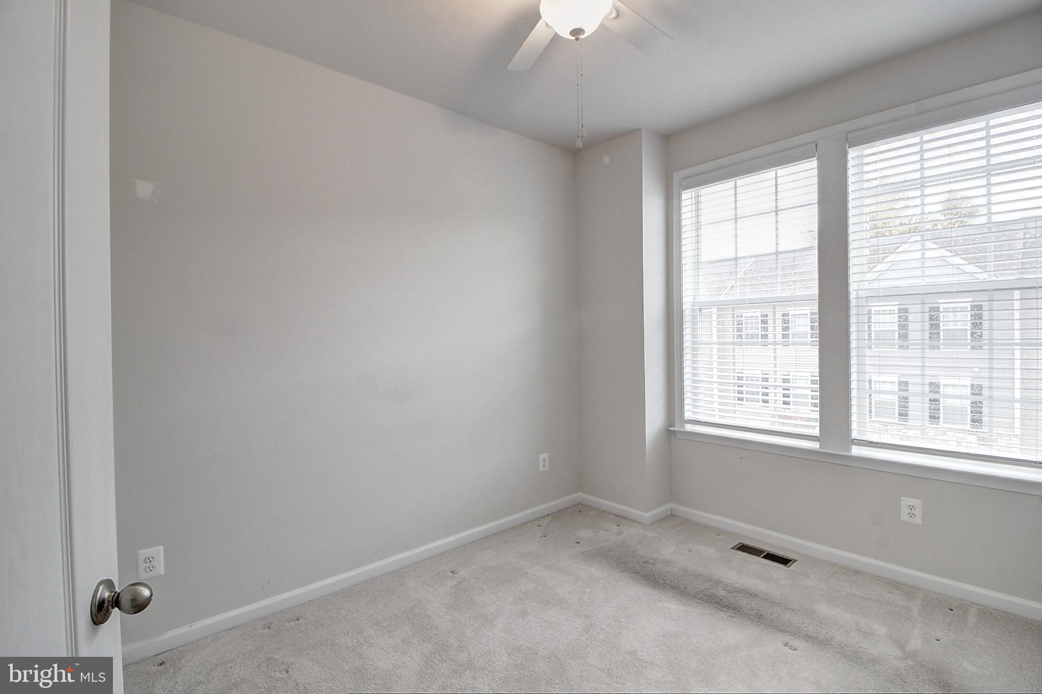 304 Spring Bank Way Frederick, MD 21701 - Photo 24 of 27 an empty room with a window
