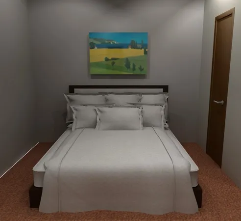 a bedroom with a bed and painting on the wall