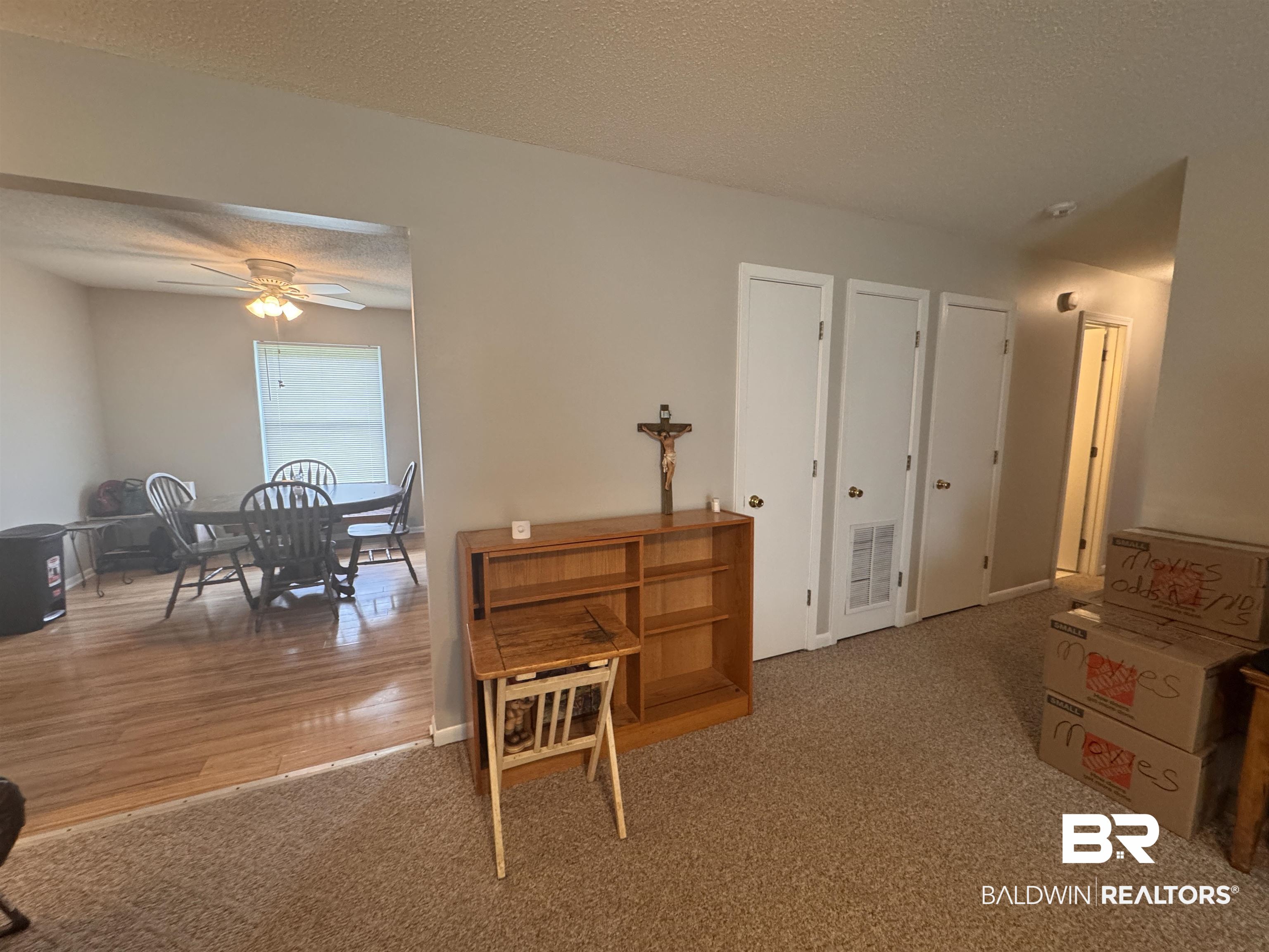 15148 Highland Circle Foley, AL 36535 - Photo 13 of 47 Interior space featuring a textured ceiling, carpet floors, and ceiling fan