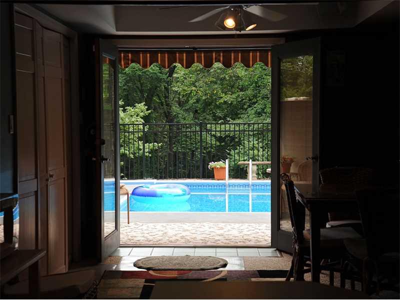 1820 Hassam Road Coraopolis, PA 15108 - Photo 17 of 25 View. from game room to the in ground pool
