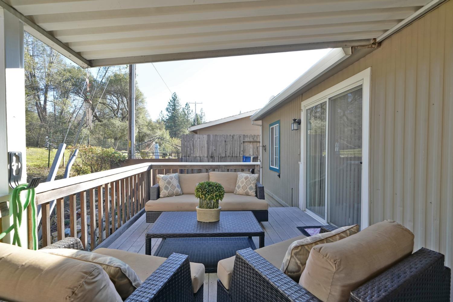 1281 Pleasant Valley Road, Unit 24 Diamond Springs, CA 95619 - Photo 1 of 1 a view of balcony with furniture and wooden deck
